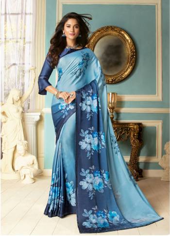 Enhance Your Personality Wearing this Designer Saree In Blue Color Paired With Blue Colored Blouse This Saree And Blouse Are Fabricated On Rich Fancy Fabrics Beautified With Floral Prints Stone Work Which IS Soft Towards Skin And Easy To Carry All Day Long.