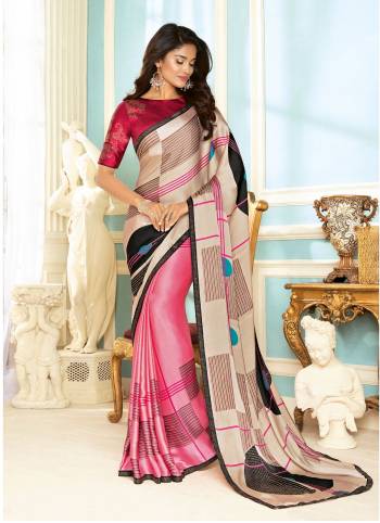 Go With This Shades Of Pink With This Pretty Saree In Light Pink And Pink Color Paired With Magenta Pink Colored Blouse. This Saree And Blouse are Fabricated On Fancy Fabric Beautified With Prints And Stone Work. Its Pretty Colors And Simple Prints Will Earn You Lots Of Compliments From Onlookers.