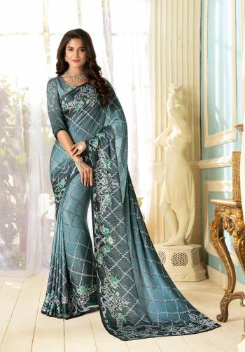 Color That Suits Every Age Group Is Here, Grab This Designer Saree In Grey Color Paired With Grey Colored Blouse. This Saree And Blouse Are Fabricated On Fancy Fabric Beautified With Prints And Stone Work. This Saree Is Light Weight And Easy To Carry All Day Long. Buy It Now.