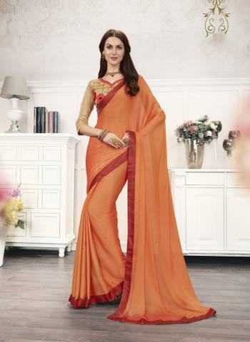 Orange Color Induces Perfect Summery Appeal To Any Outfit, So Grab This Designer Saree In Orange Color Paired With Beige Colored Bouse. This Saree Is Fabricated On Chiffon Paired With Art Silk Fabricated Blouse. It Is Beautified With Embroidery Over The Blouse And Saree With Pearl Work.