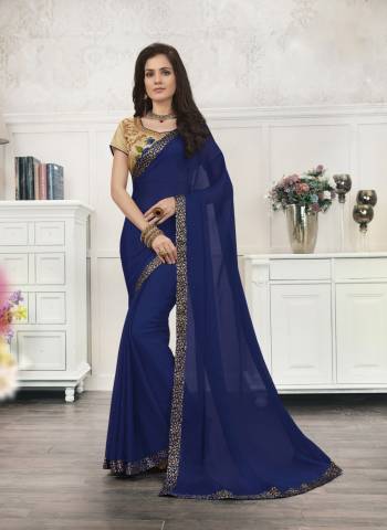 Enhance Your Personality Wearing This SareeIn Blue Color Paired With Beige Colored Blouse. This Saree Is Fabricated On Chiffon Paired With Art Silk Fabricated Blouse. It Is Light In Weight And Also Easy To Carry All Day Long. Buy Now.