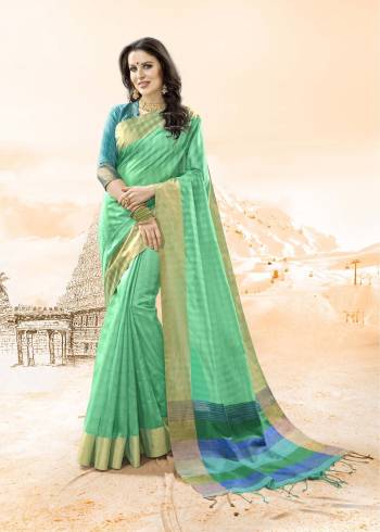 Add This Pretty Shade In Green to Your Wardrobe With This Saree In sea Green Color Paired With Contrasting Turquoise Blue Colored Blouse. This Saree And Blouse Are Fabricated On Handloom Cotton Silk. Buy Now.