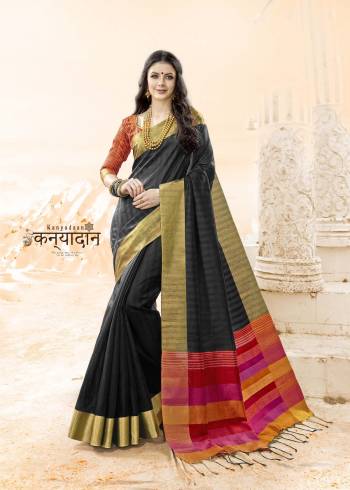 Enhance Your Beauty Wearing this Saree In Black Color Paired With Orange Colored Blouse. This Saree And Blouse Are Fabricated On Handloom Cotton Silk Which Is Easy To Drape And Carry All Day Long.