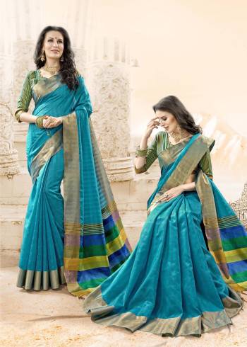 Look Pretty In This Shade Of Blue With This Saree In Turquoise Blue Color Paired With Contrasting Green Colored Blouse. This Saree And Blouse Are Fabricated On Handloom Cotton Silk. It IS Resonable And Rich Looking Fabric.