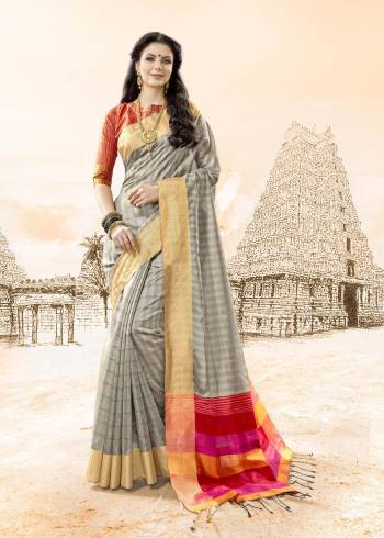 Flaunt Your Rich And Elegant Taste Wearing This Saree In Grey Color Paired With Contrasting Orange Colored Blouse. This Saree And Blouse Are Fabricated On Handloom Cotton Silk. It Is Light Weight And Easy To Carry All Day Long.