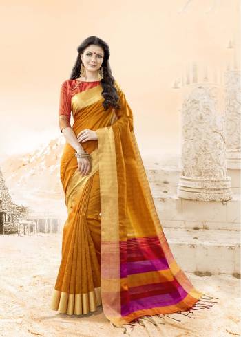 Celebrate This Festive Season Wearing This Saree In Musturd Yellow Color Paired With Contrasting Orange Colored Blouse. This Saree And Blouse Are Fabricated On Handloom Cotton Silk. Its Fabric Ensures Superb Comfort All Day Long.