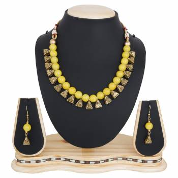 Give An Elegant Look To Your Neckline With This Beautiful Necklace Set Beautified With Yellow Colored Motis.