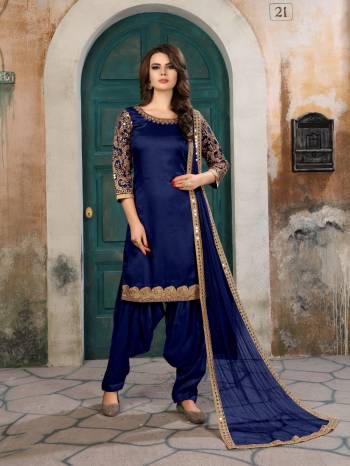 Bright And Visually Appealing Color Is Here With This Designer Suit In Royal Blue Color Paired With Royal Blue Colored Bottom And Dupatta. Its Top Is Fabricated On Art Silk Paired With Santoon Bottom And Net Dupatta. Pair This Up With Jhumki Earrings To Complete The Look.