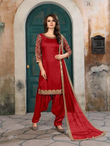 Adorn The Angelic Look Wearing This Suit In Red Color Paired With Red Colored Bottom And Dupatta. Its Top Is Fabricated On Art Silk Paired With Santoon Bottom And Net Dupatta. It Has Attractive Embroidery Over The Sleeves, Panel And Border Of Dupatta. Buy It Soon.