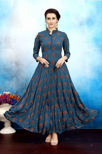 Here Is A Designer Long Readymade Kurti In Blue Color Fabricated On Rayon Cotton Beautified With Prints And Cold Shoulder Pattern. This Kurti Is Available In Many Sizes And Also Ensures Superb Comfort All Day Long.