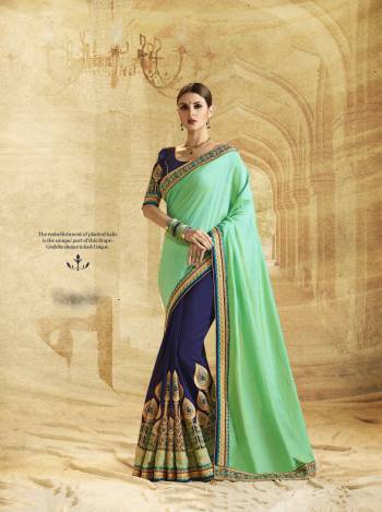 Combination Of Dark And Light Always Compliments Each Other. So Grab This Attractive Saree In Sea Green And Navy Blue Color Paired With Navy Blue Colored Blouse. This Saree Is Fabricated On Art Silk And Georgette Paired With Art Silk Fabricated Blouse. 