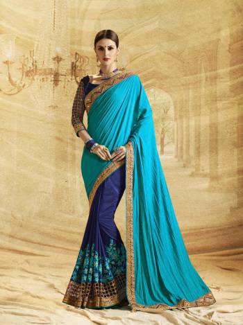 Go With The Shades Of Blue Wearing This Saree In Dark And Light Blue Color Paired With Navy Blue Colored Blouse. This Saree Is Fabricated On Paper Art Silk Paired With Art Silk Fabricated Blouse. It Is Beautified With Embroidery All Over Making The Saree More Attractive.