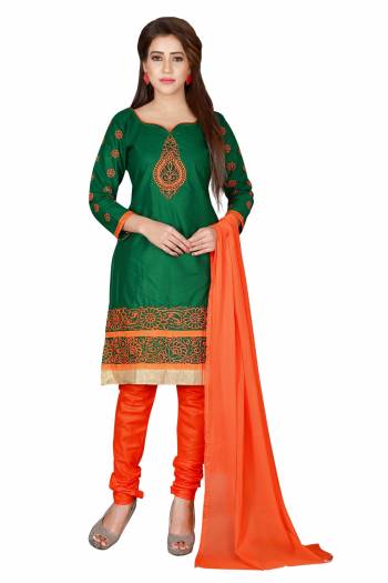 Here Is A Simple Dress Material For Your Casual Wear In Green Colored Top Paired With Contrasting Orange Colored Bottom And Dupatta. Its Top Is Fabricated On Chanderi Cotton Paired With Santoon Bottom And Chiffon Dupatta. Get This Stitched As Per Your Desired Fit And Comfort.