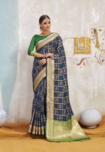 Enhance Your Personality Wearing This Saree In Navy Blue Color Paired With Contrasting Green Colored Blouse. This Saree And Blouse Are Fabricated On Art Silk Beautified With Weave. It Is Light Weight And Easy To Carry All Day Long.