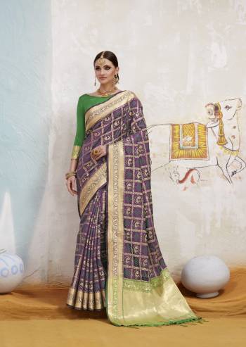 Add This Pretty Shade To Your Wardrobe In Purple Color Paired With Contrasting Green Colored Blouse. This Saree And Blouse Are Fabricated On Art Silk Beautified With Weave All Over It. This Saree Is Light Weight And easy To Drape. Buy Now.