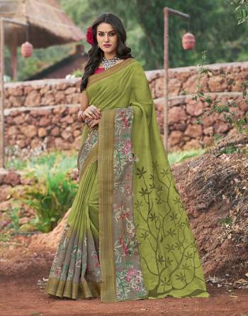 Comfort Is The First Thing Comes To Our Mind When We Buy Clothes, So Grab This Light Weight And Pretty Saree In Green Color Paired With Contrasting Pink Colored Blouse. This Saree And Blouse Are Fabricated On Cotton Silk Beautified With Prints. 