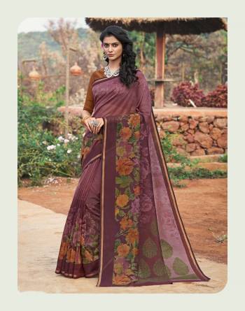 New And Unique Shade Is Here With This Saree In Wine Saree Color Paired With Contrasting Brown Colored Blouse. This Saree And Blouse Are Fabricated On Cotton Silk Beautified With Prints All Over It. It Is Light Weight And Easy To Carry All Day Long.