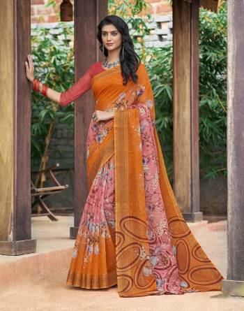 Orange Color Induces Perfect Summery Appeal To Any Outfit So Grab This Saree In Orange Color Paired With Contrasting Peach Colored Blouse. This Saree And Blouse Are Fabricated On Cotton Silk Beautified With Prints All Over It.