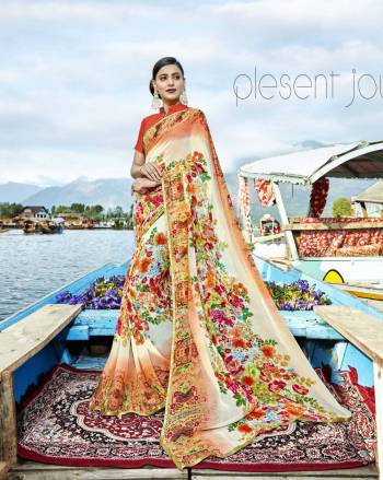 Go Colorful In This Lovely Multi Colored Saree Paired With Orange Colored Blouse. This Saree Has Weightless Fabric Paired With Art Silk Fabricated Blouse. It Is Beautified With Prints All Over It. Buy Now.