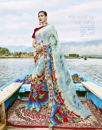 For Your Semi-Casual Wear, Grab This Pretty Saree In Light Blue And Multi Color Paired With Contrasting Red Colored Blouse. This Saree Is Fabricated On Weightless Paired With Art Silk Fabricated Blouse. Its Has Beautiful Multi Colored Prints All Over Making The Saree More Attractive.