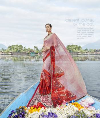 Look Pretty In This Lovely Baby Pink And Red Colored Saree Paired With Contrasting Red Colored Blouse. This Saree Has Weightless Fabric Paired With Art Silk Fabricated Blouse. It Has Pretty Prints Over The Saree And This Beautiful Combination Will earn You Lots Of Compliments From Onlookers. 