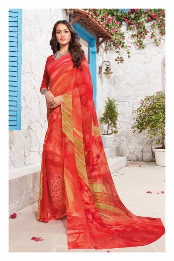 Adorn The Pretty Angelic Look Wearing This Saree In Red Color Paired With Red Colored Blouse. This Saree And Blouse Are Fabricated On Georgette Beautified With Abstract Prints. 