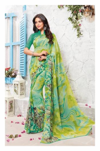 Shades Of Green Gives A Fresh Summery Look, Grab This Pretty Saree In Multiple Shades Of Green Paired With Green Colored Blouse. This Saree And Blouse Are Fabricated On Georgette Beautified With Prints. Buy It Now.