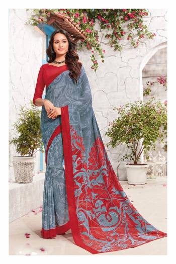 Flaunt Your Rich And Elegant Taste Wearing This Printed Saree In Grey Color Paired With Contrasting Red Colored Blouse. This Saree And Blouse Are Fabricated On Georgette Beautified With Prints All Over. Buy This Saree Now.