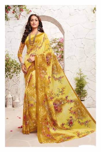 Here Is A Shaded Saree In Yellow Color Paired With Yellow Colored Blouse. This Saree And Blouse Are Fabricated On Georgette Beautified With Contrasting Colored Floral Prints All Over It.