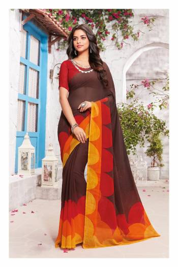 Simple and Elegant Looking Saree Is Here In Dark Brown Color Paired With Contrasting Red Colored Blouse. This Saree And Blouse Are Fabricated On Georgette Beautified With Simple Bold Prints With Contrasting Colors. Buy This Pretty Saree Now.