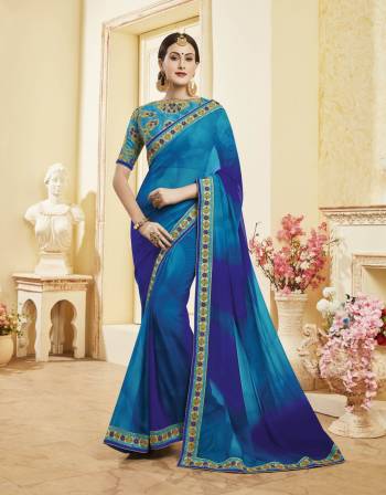 Here Is A Designer Shaded Saree In Blue Color Paired With Blue Colored Blouse. This Saree Is Fabricated On Georgette Paired With Art Silk Fabricated Blouse. It Has Embroidery Over The Blouse And Lace Border. Buy This Designer Saree Now.