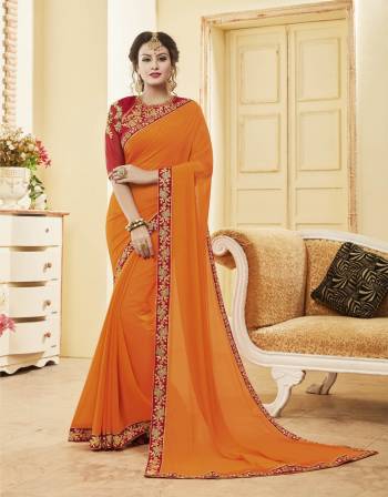 Orange And Red Color Induces Perfect Summery Appeal To Any Outfit, So Grab This Designer Saree In Orange Color Paired With Contrasting Red Colored Blouse. This Saree Is Fabricated On Georgette Paired With Art Silk Fabricated Blouse. It Has Attractive Embroidery Over The Blouse And Lace Border.