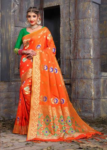 For A Proper Traditional Look, Grab This Banarasi Saree In Orange Color Paired With Contratsing Green Colored Blouse. This Saree And Blouse Are Fabricated On Art Silk Beautified With Weave. This Bright Saree Will Give You An Attractive Look Like Never Before.