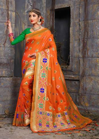 For A Proper Traditional Look, Grab This Banarasi Saree In Orange Color Paired With Contratsing Green Colored Blouse. This Saree And Blouse Are Fabricated On Art Silk Beautified With Weave. This Bright Saree Will Give You An Attractive Look Like Never Before.