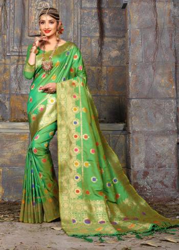 Celebrate The Festive Season Wearing This Rich Looking Banarasi Saree In Green Color Paired With Green Colored Blouse. This Saree And Blouse Are Fabricated On Art Silk Beautified With Weave. It Is Easy To Drape And Durable.