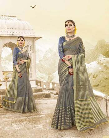 Flaunt Your Rich And Elegant Taste Wearing This Saree In Grey Blue Color Paired With Blue Colored Blouse. This Saree And Blouse are Fabricated On Handloom Cotton Silk Which Is Light In Weight And Easy To Carry All Day Long.