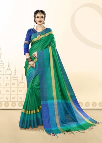 Have A Fresh Look Everytime You Wear This Saree In Green Color Paired With Contrasting Royal Blue Colored Blouse. This Saree And Blouse Are Fabricated On Khadi Cotton Silk. It Ensures Superb Comfort All Day Long.