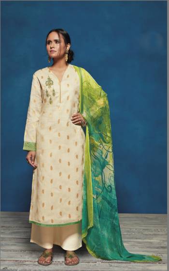 Simple and Elegant Looking Designer Semi-Stitched Suit Is Here In Cream Color Paired With Cream Colored Bottom And Green Colored Dupatta. Its Top Is Fabricated On Satin Jacquard Paired With Cotton Bottom And Chiffon Dupatta. 