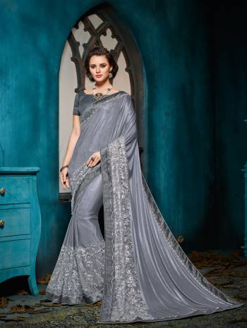 Impress everyone with your amazing Trendy look by draping this Grey color imported coated fabrics with heart work with jacquard border saree. this party wear saree won't fail to impress everyone around you. this gorgeous saree featuring a beautiful mix of designs. Its attractive color and designer heavy embroidered design, moti, cut paste design, beautiful floral design work over the attire & contrast hemline adds to the look. Comes along with a contrast unstitched blouse.