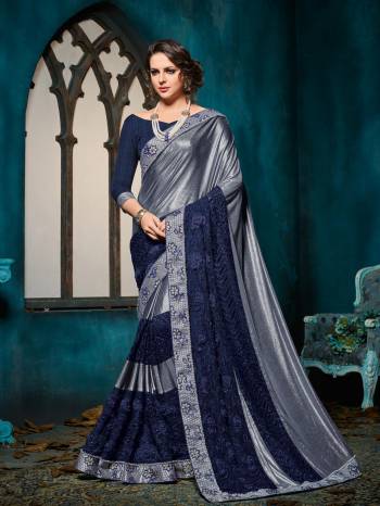 Presenting this Grey & Navy Blue color imported coated fabrics with heavy work with jacquard border saree. look gorgeous at an upcoming any occasion wearing the saree. this party wear saree won't fail to impress everyone around you. Its attractive color and designer heavy embroidered design, patch design, moti, cut paste design, beautiful floral design work over the attire & contrast hemline adds to the look. Comes along with a contrast unstitched blouse.