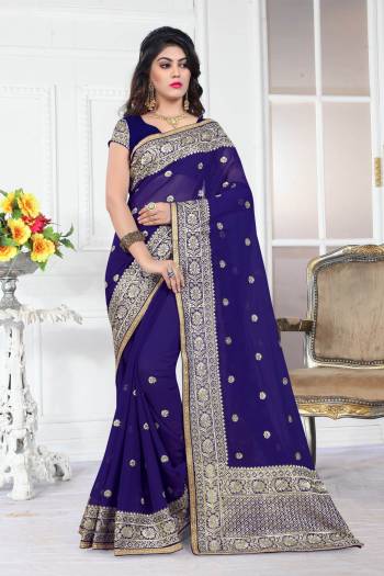 Enhance Your Personality Wearing This Saree In Navy Blue Color Paired With Navy Blue Colored Blouse. This Saree And Blouse Are Fabricated On Georgette Beautified With Jari Work. Buy This Pretty Saree Now.