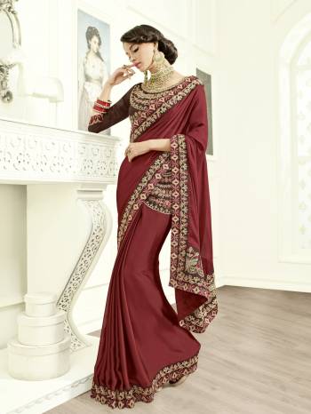 Drape this maroon color Crepe silk fabrics saree. this gorgeous saree featuring a beautiful mix of designs. look gorgeous at an upcoming any occasion wearing the saree. Its attractive color and designer heavy embroidered design, Stone work, beautiful patch work, beautiful floral design work over the attire & contrast hemline adds to the look. Comes along with a contrast unstitched blouse.