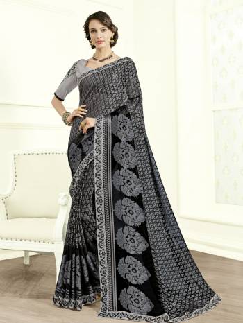 Gorgeously mesmerizing is what you will look at the next wedding gala wearing this beautiful grey color two tone slub saree. Ideal for party, festive & social gatherings. this gorgeous saree featuring a beautiful mix of designs. Its attractive color and designer heavy embroidered design, Stone work, beautiful patch work, beautiful floral design work over the attire & contrast hemline adds to the look. Comes along with a contrast unstitched blouse.