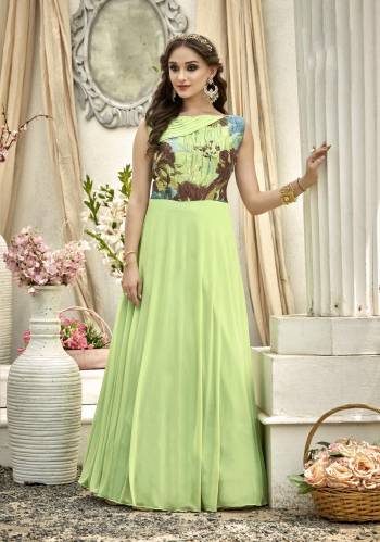 Simple And Elegant Looking Readymade Designer Gown Is Here In Light Green Color Fabricated On Fancy Fabric Beautified With Prints Over The Yoke. Buy Now.