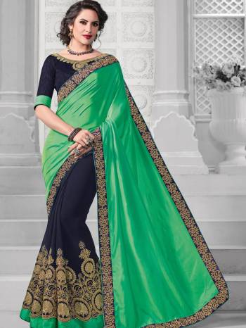 Change your wardrobe and get classier outfits like this gorgeous green and Navy Blue color two-tone silk and georgette saree. Ideal for party, festive & social gatherings. this gorgeous saree featuring a beautiful mix of designs. Its attractive color and designer embroidered design, patch design, attractive stone design, beautiful floral design work over the attire & contrast hemline adds to the look. Comes along with a contrast unstitched blouse.