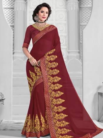 You Look elegant and stylish this festive season by draping this maroon color marble chiffon saree. Ideal for party, festive & social gatherings. this gorgeous saree featuring a beautiful mix of designs. Its attractive color and designer embroidered design, patch design, Full saree, attractive stone design, beautiful floral design work over the attire & contrast hemline adds to the look. Comes along with a contrast unstitched blouse.