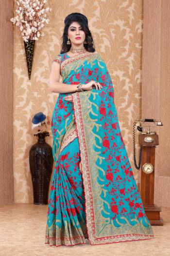 Add This Pretty Saree To Your Wardrobe In Heavy Collection With This Designer Saree In Turquoise Blue Color Paired With Turquoise Blue Colored Blouse. This Saree And Blouse Are Fabricated On Georgette Beautified With Thread And Jari Work.