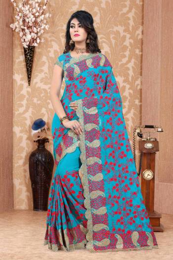 Add This Pretty Saree To Your Wardrobe In Heavy Collection With This Designer Saree In Turquoise Blue Color Paired With Turquoise Blue Colored Blouse. This Saree And Blouse Are Fabricated On Georgette Beautified With Thread And Jari Work.