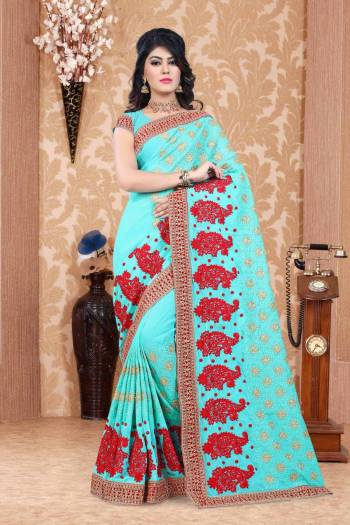 Pretty Attractive Shade In Blue Is Here With This Designer Saree In Aqua Blue Color Paired With Aqua Blue Colored Blouse. This Saree And Blouse Are Fabricated On Georgette Beautified With Heavy Embroidery. It Is Easy To Drape And Carry All Day Long.