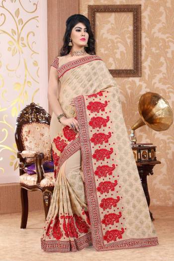 Flaunt Your Rich And Elegant Taste Wearing This Designer Saree In Beige Color Paired With Beige Colored Blouse. This Saree And Blouse Are Fabricated On Georgette Beautified With Heavy Embroidery All Over It. Buy This Saree Now.